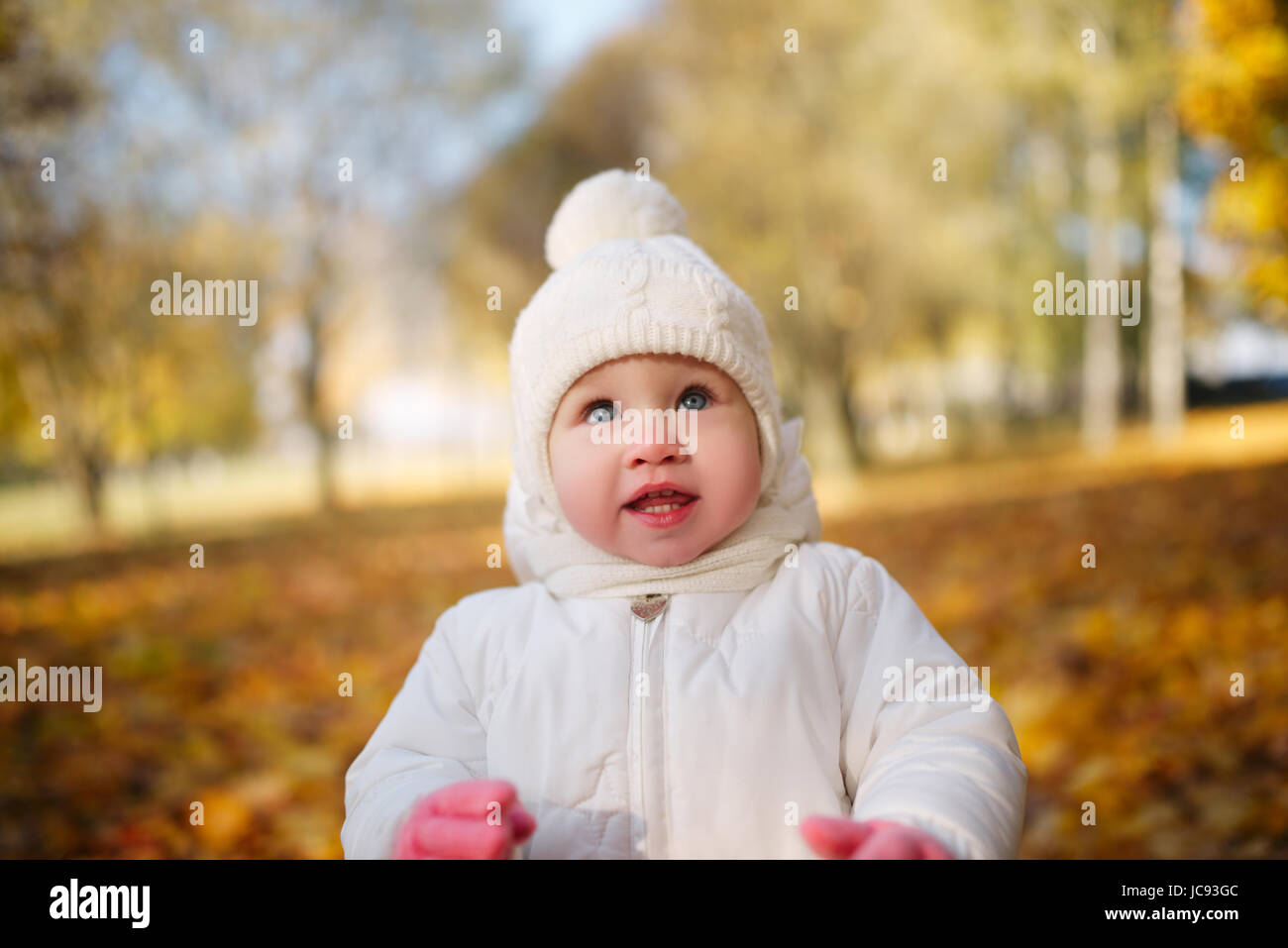 happy little girl in autumn park Stock Photo - Alamy