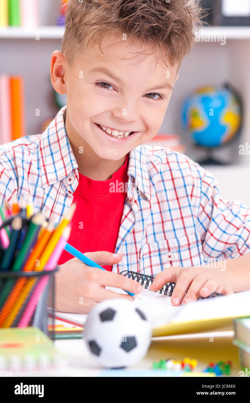 Boy sitting at desk hires stock photography and images Alamy