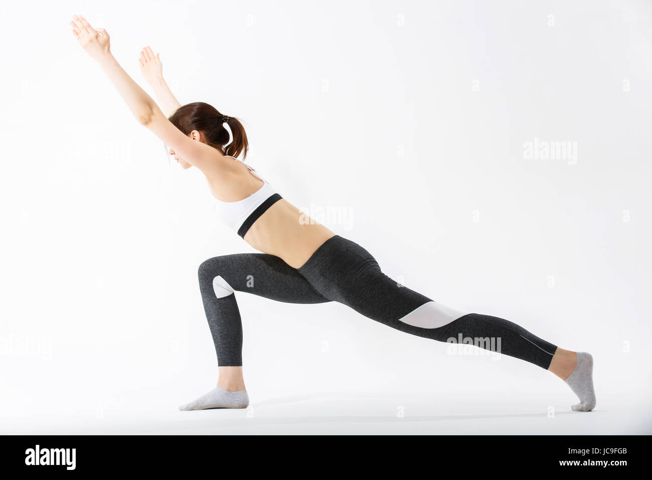 Young woman exercise yoga supported headstand Stock Photo Alamy