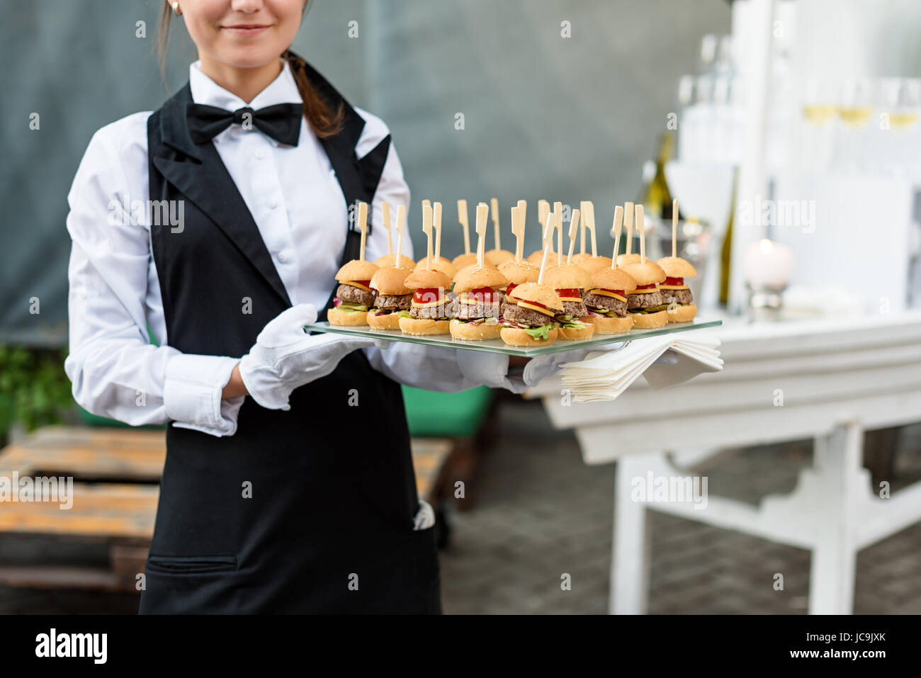 Catering Service Waiter Carrying A Tray Of Appetizers Outdoor Party