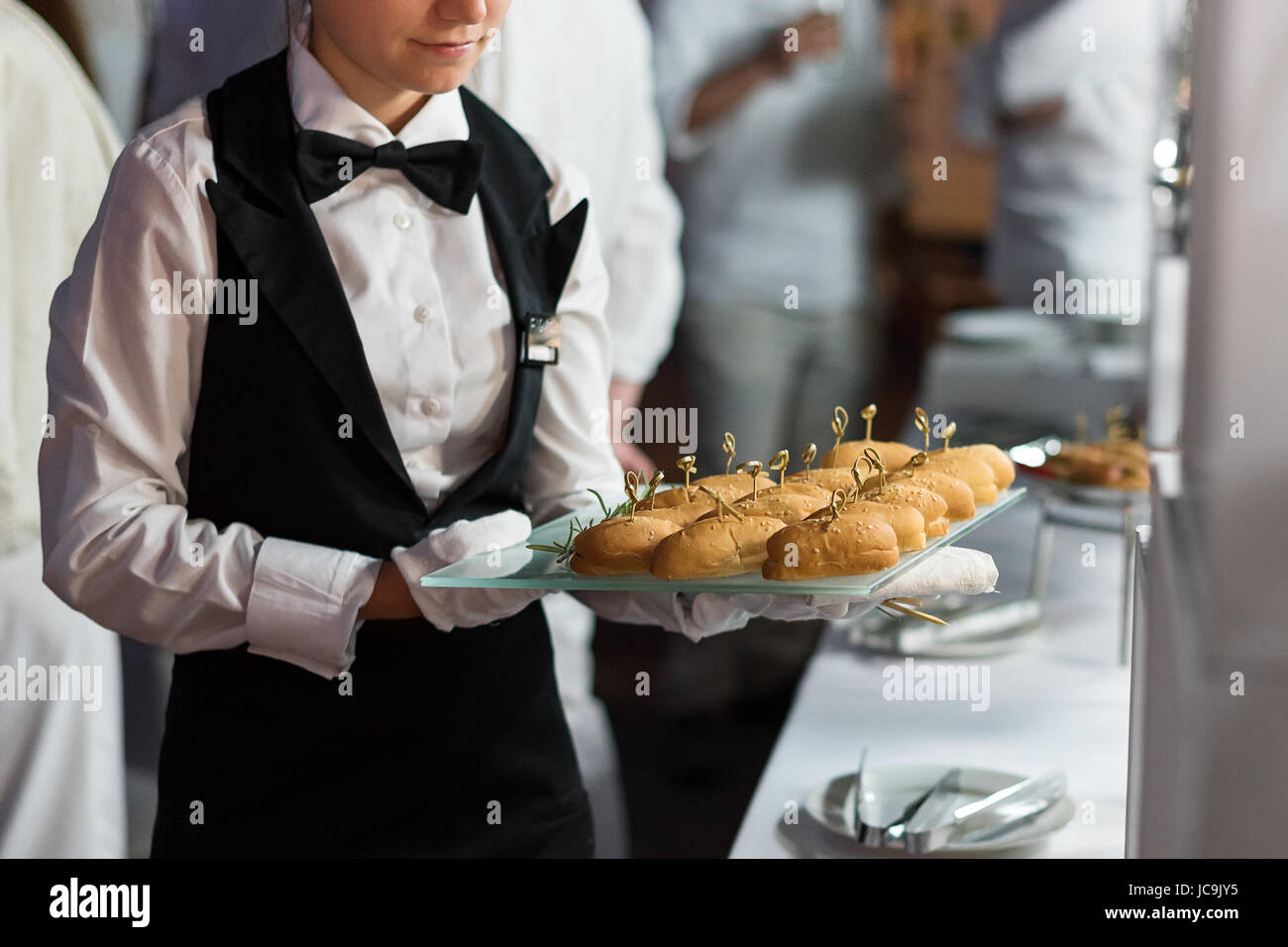 Catering Service Waiter Carrying A Tray Of Appetizers Outdoor