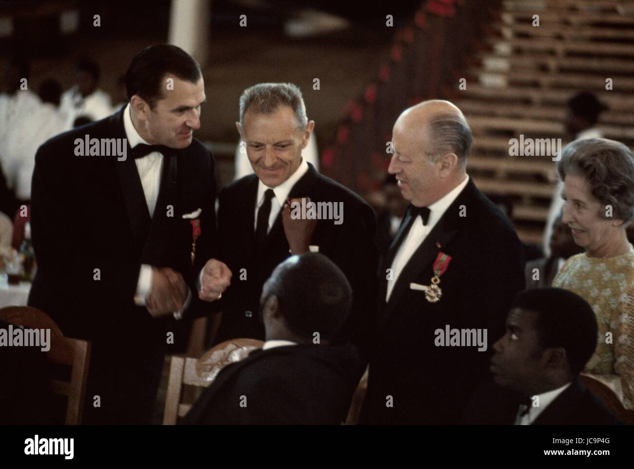 French politician Jacques Foccart (General De Gaulle's counsellor for African affairs) is receiving the Order of the Bokassa Operation.  Turned back, Jean-Bedel Bokassa.  1970 Stock Photo