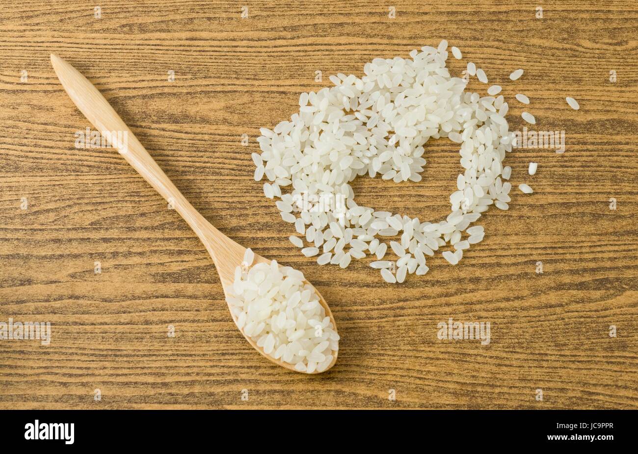 Japanese Cuisine, Raw and Uncooked Japanese Rice in A Wooden Spoon and ...