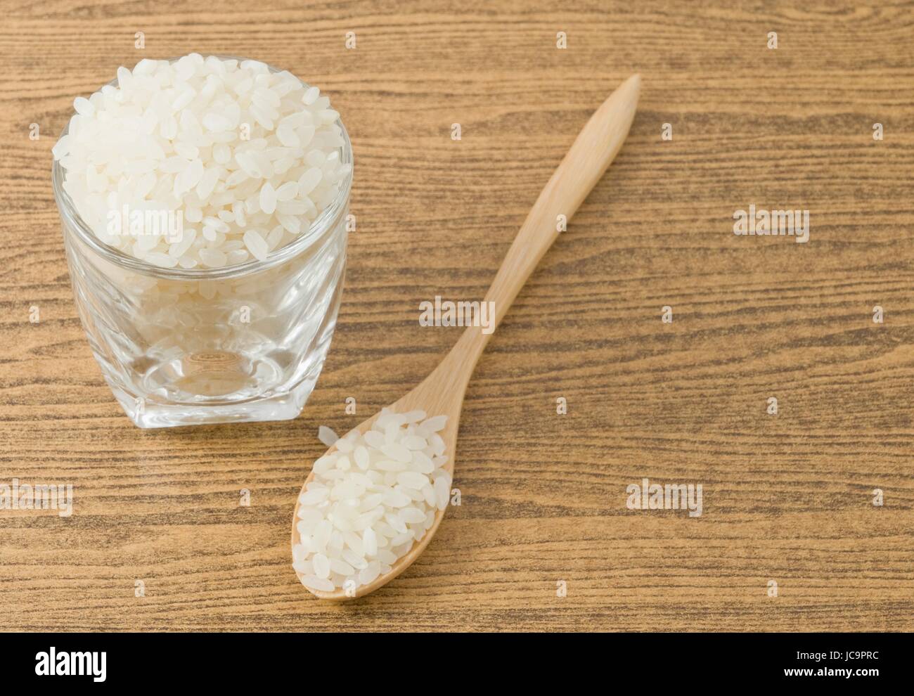 Japanese Cuisine, Raw and Uncooked Japanese Rice in A Wooden Spoon and ...