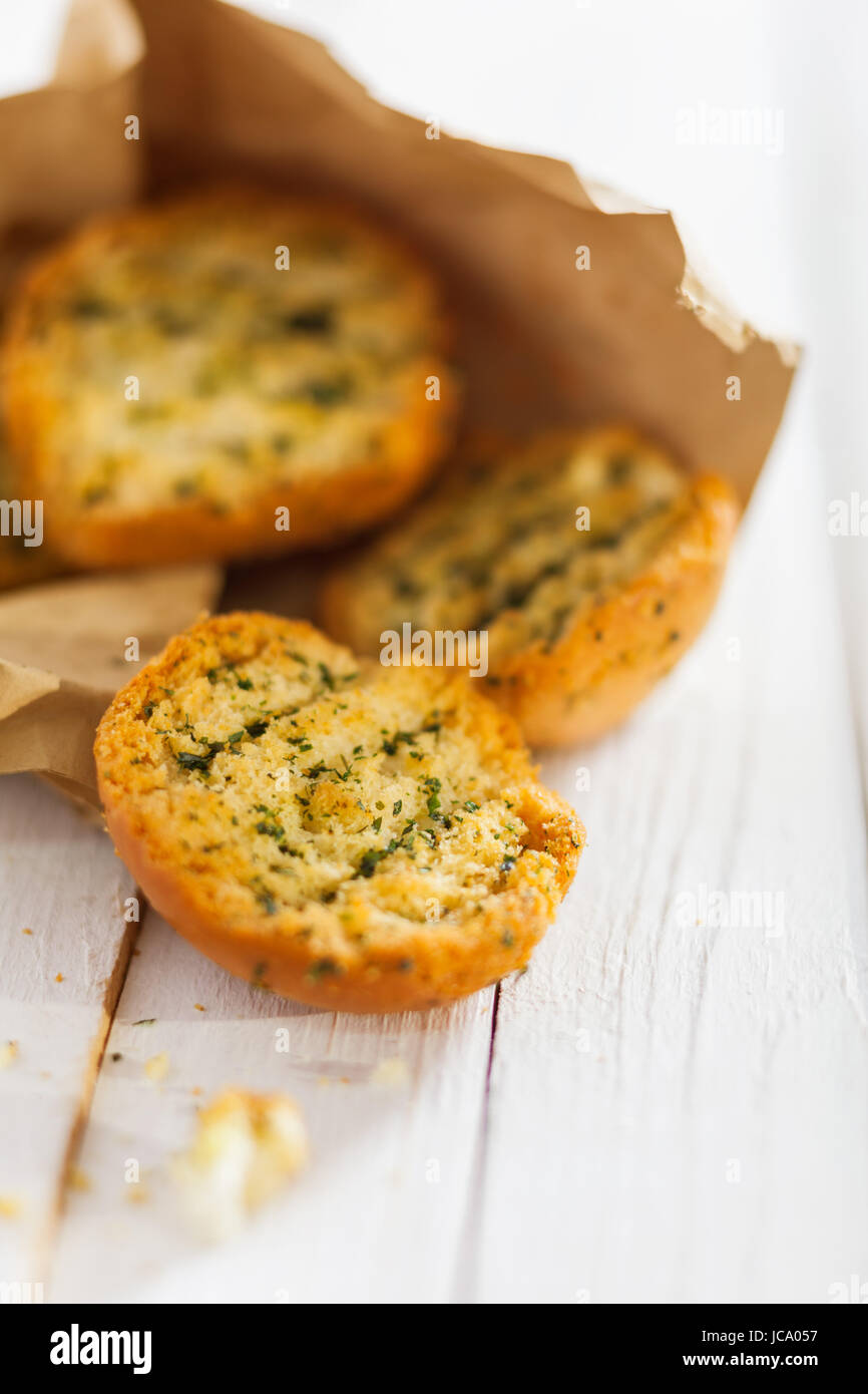 Crisp crunchy golden toasted or grilled herb buns or slices of baguette ...