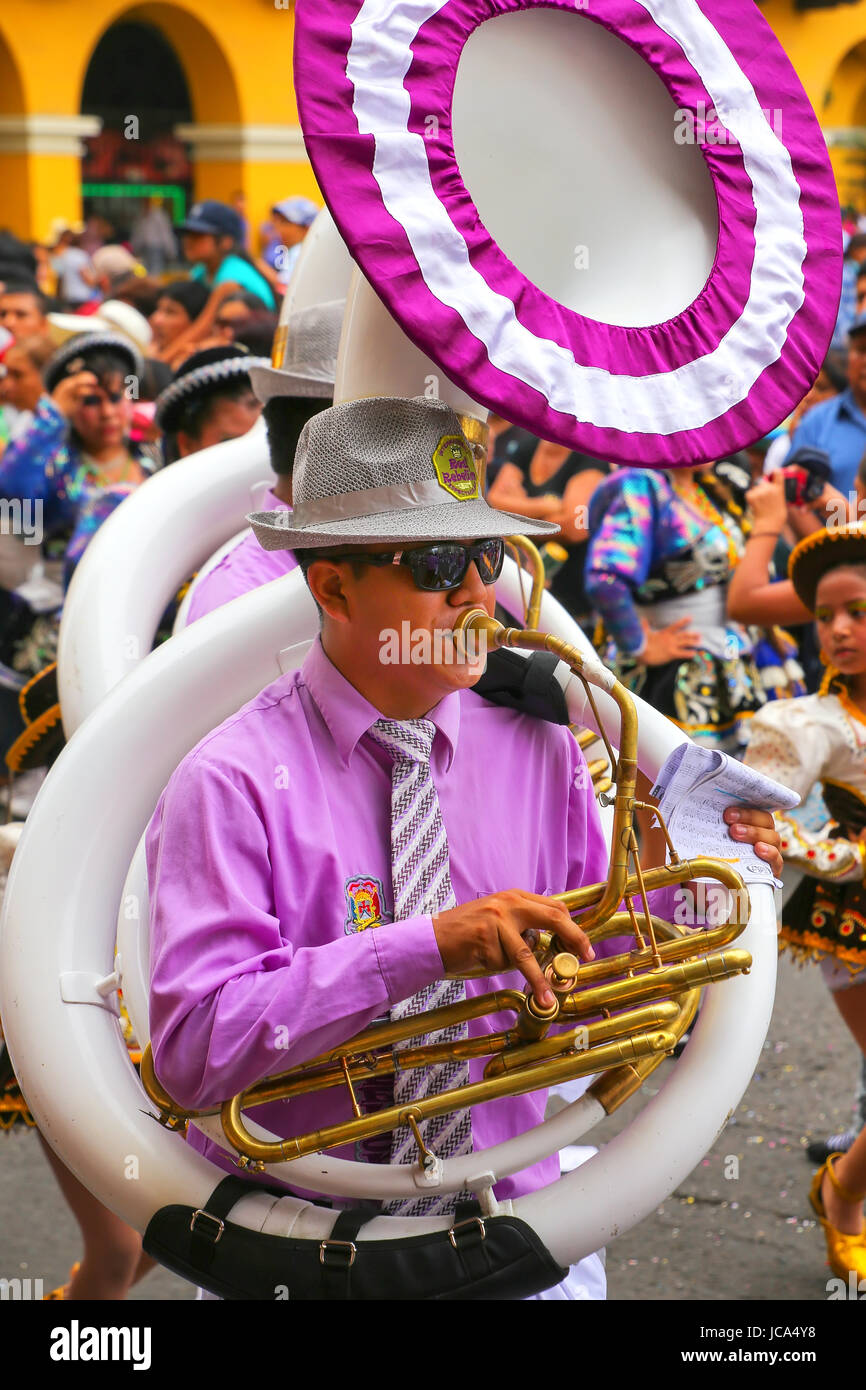 Local man playing sousaphone during Festival of the Virgin de la Candelaria in Lima, Peru. The core of the festival is dancing and music performed by  Stock Photo