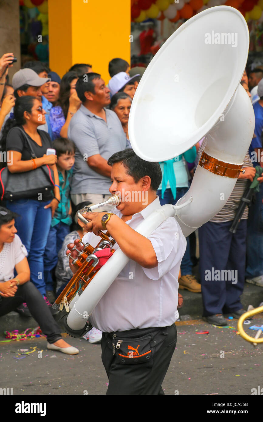 Local man playing sousaphone during Festival of the Virgin de la Candelaria in Lima, Peru. The core of the festival is dancing and music performed by  Stock Photo