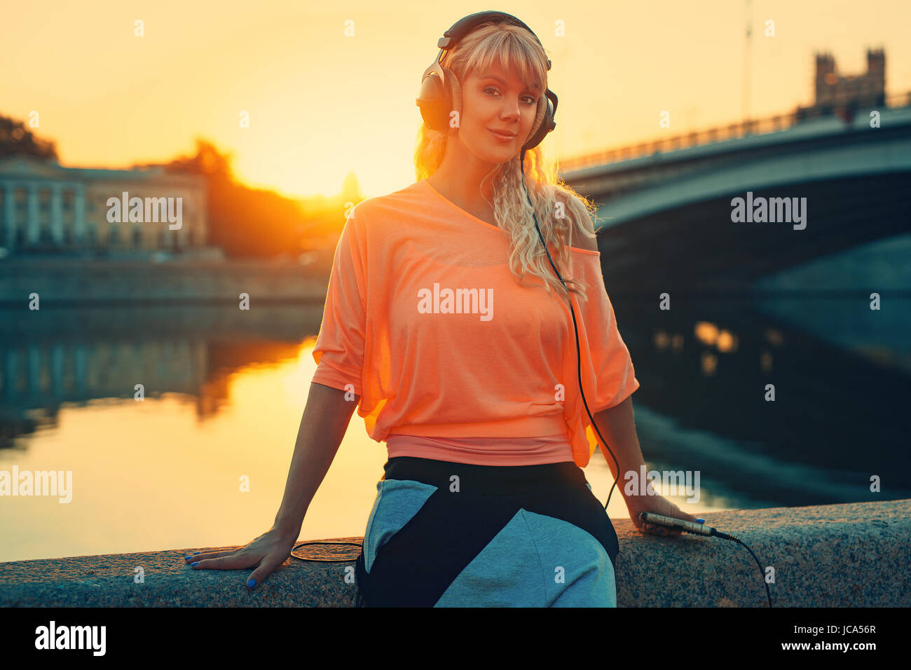 Blond woman sitting bridge hi-res stock photography and images - Alamy