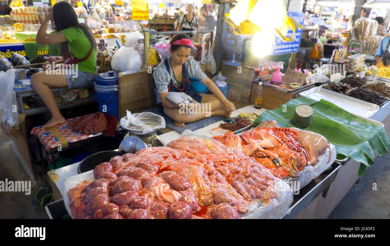 Chiang Mai: Thailand 27-May-2011: Two ladies hard at work at the market in Chiang Mai. Stock Photo