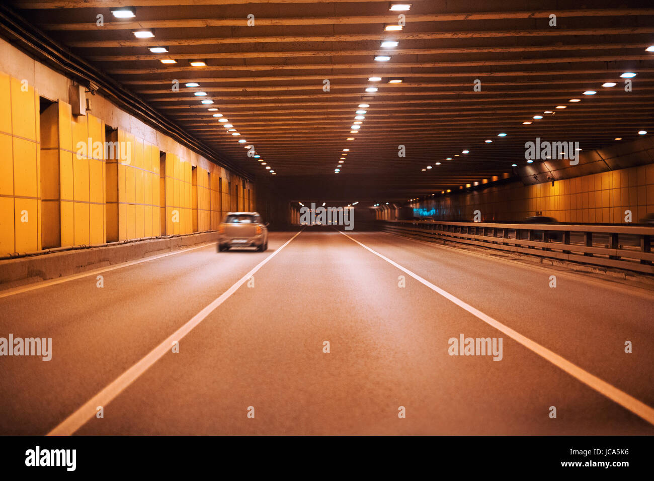Underground modern highway tunnel with several cars Stock Photo