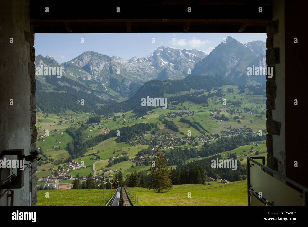 Looking back on tram tracks down into the Toggenburg valley of Switzerland. Stock Photo