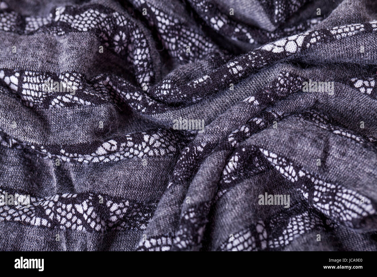 grauer antrazit farbener Stoff aus Wolle Baumwolle mit Spitze Struktur textur als Nahaufnahme Stock Photo