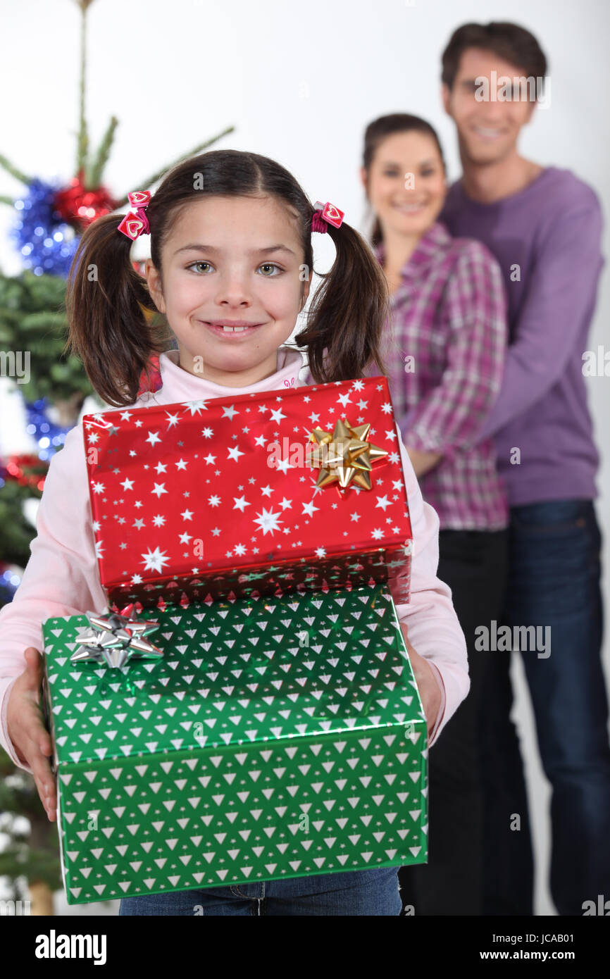 little girl receiving her Christmas presents Stock Photo - Alamy