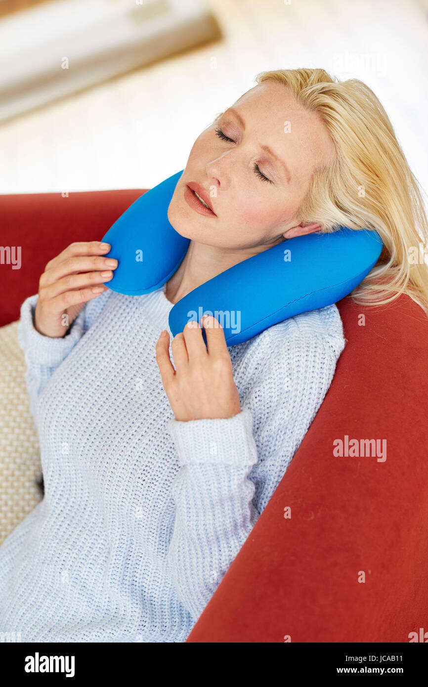 Woman wearing neck cushion Stock Photo