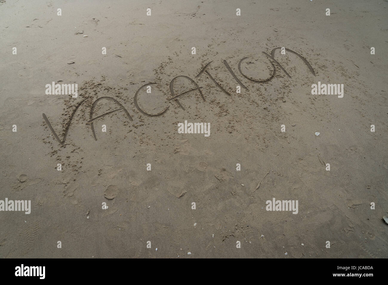 sand writing word vacation beach relax Stock Photo