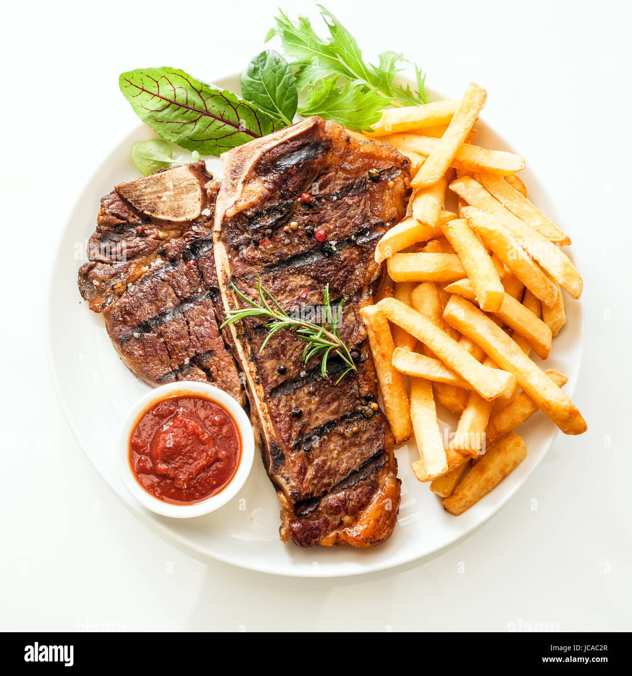 Grilled tbone or porterhouse steak seasoned with rosemary and served