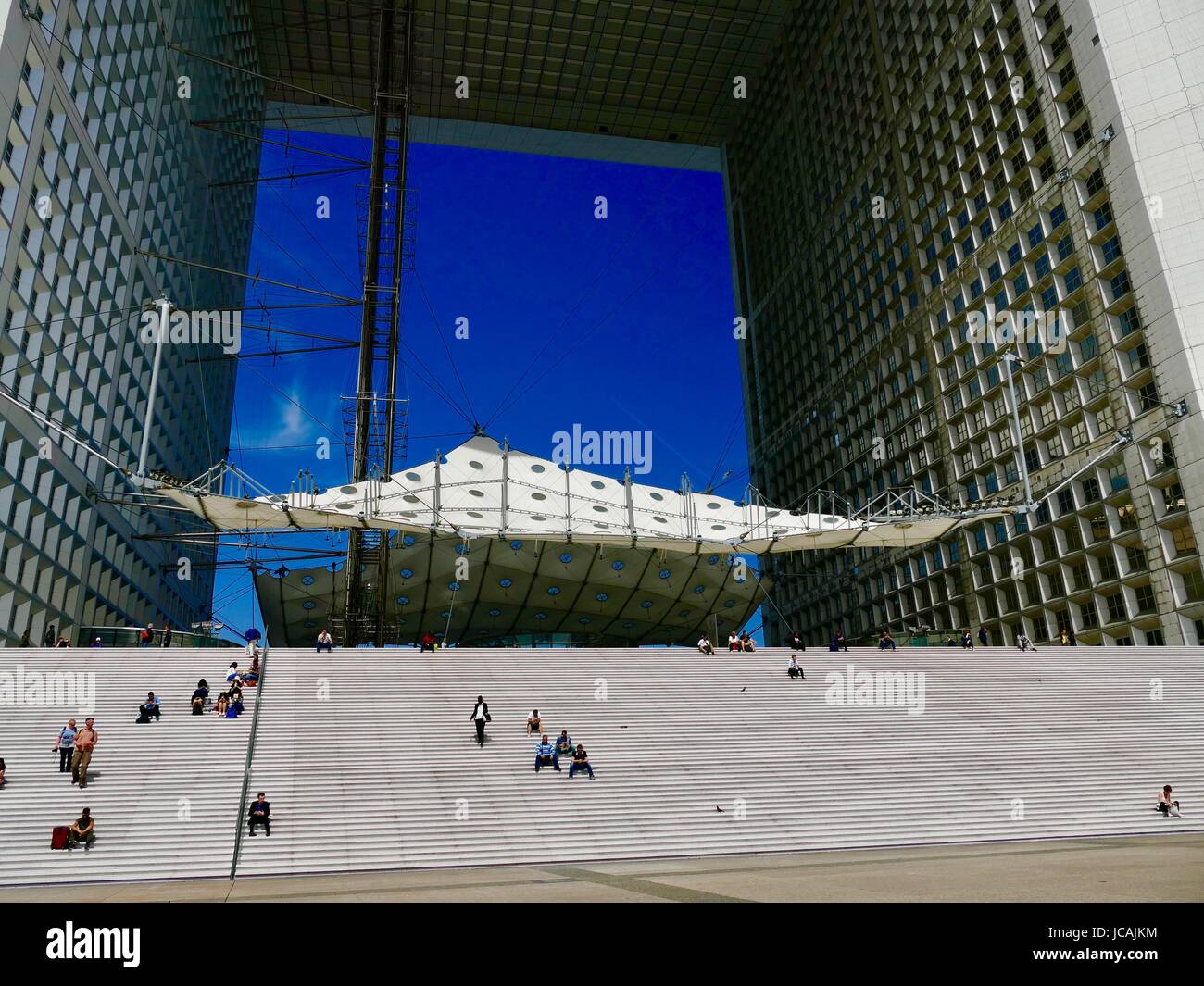 Canopy Grande Arche La Défense with people sitting on the steps