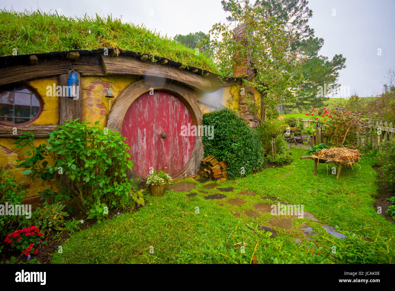 NORTH ISLAND, NEW ZEALAND- MAY 16, 2017: Hobbit house with red door, hobbiton movie set, site made for movies: Hobbit and Lord of the ring in Matamata Stock Photo