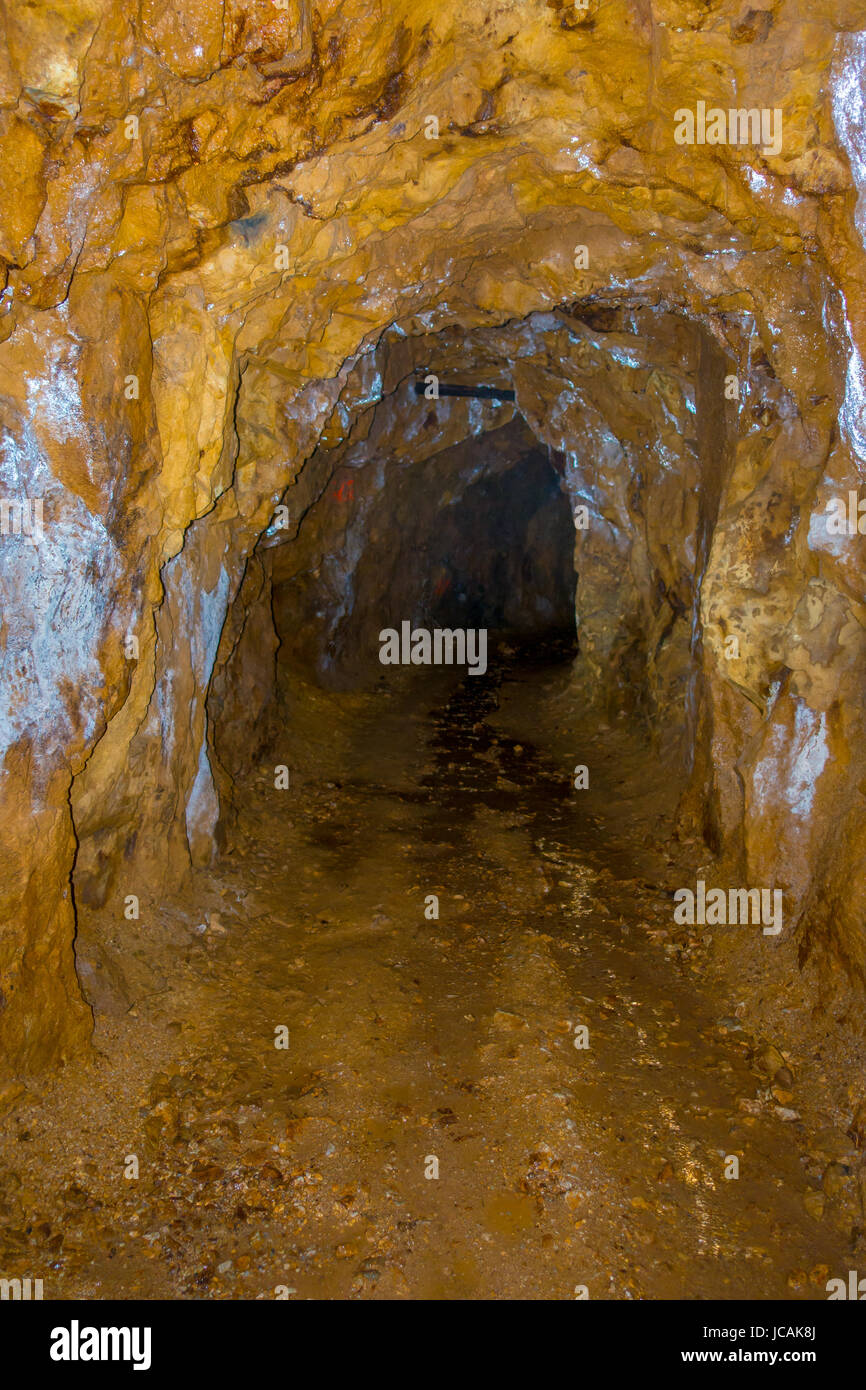 New Zealand, a gold mine and railtrack with lorries seen from