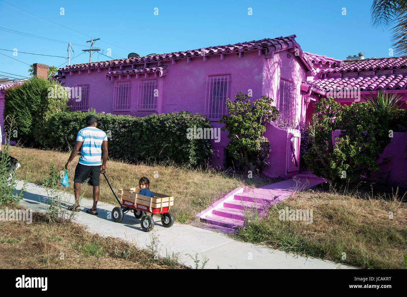 Neighborhood houses painted bright pink as part of an art project in Los Angeles, CA. curated by Impermanent Art. Stock Photo