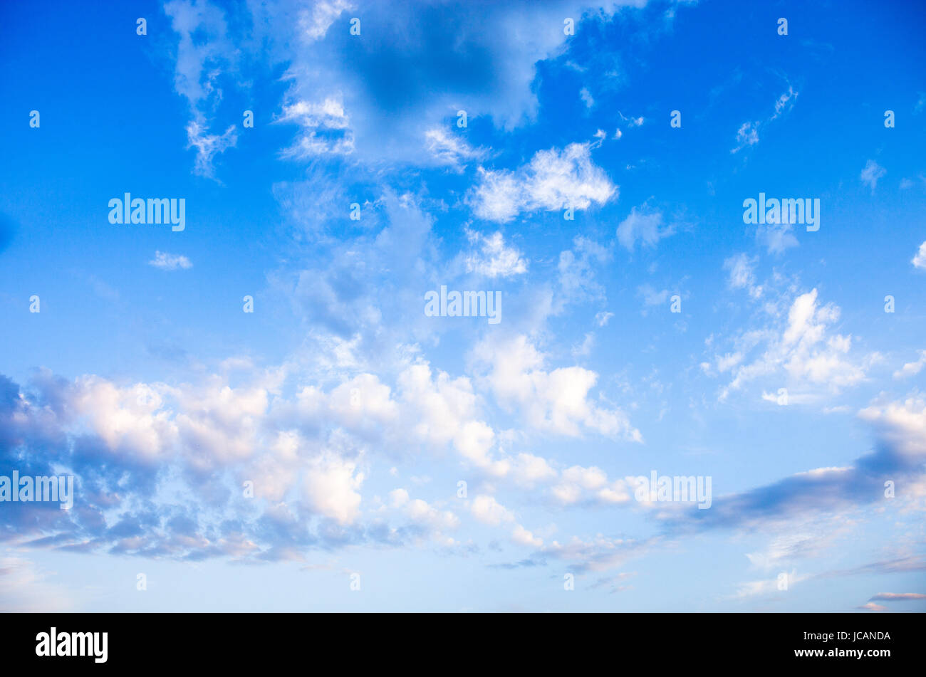 Blue sky with lots of white clouds Stock Photo - Alamy