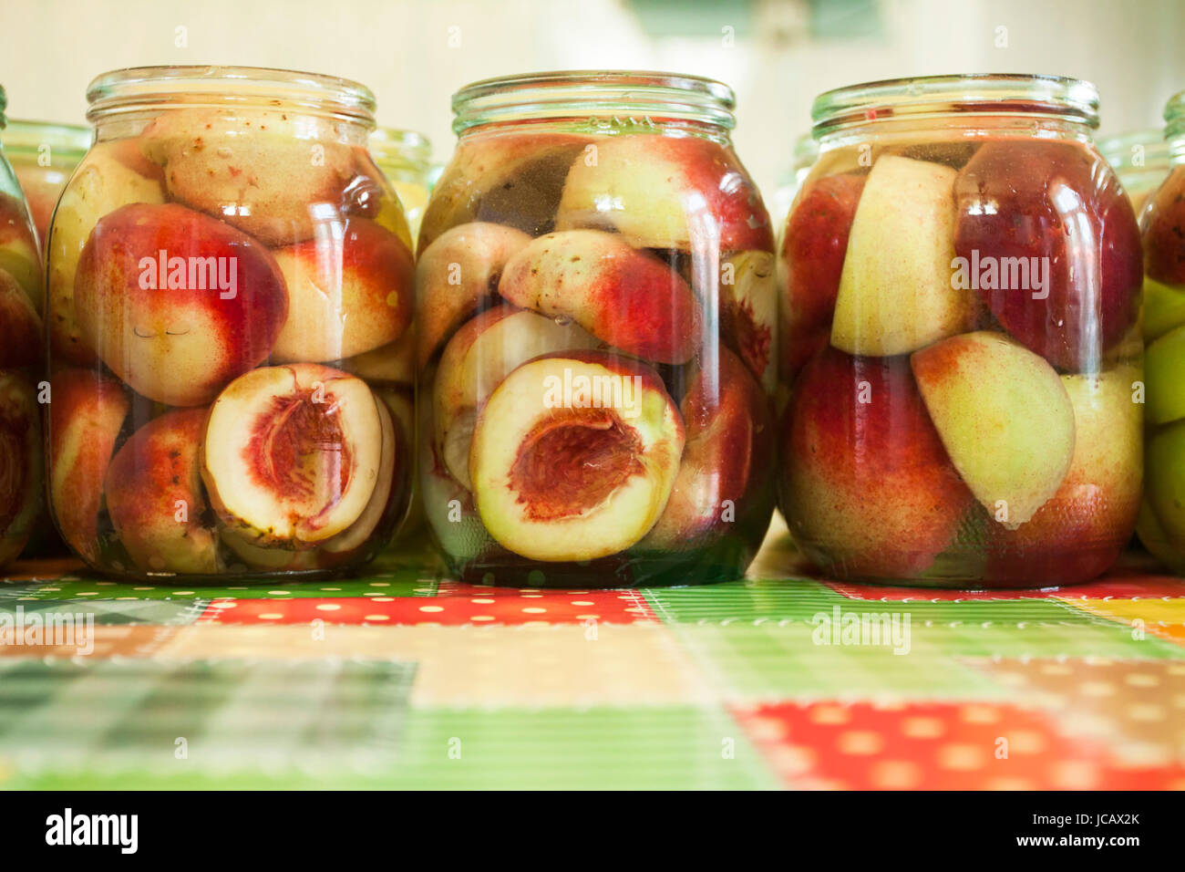 Jars of homemade fruit preserves peach compote Stock Photo Alamy