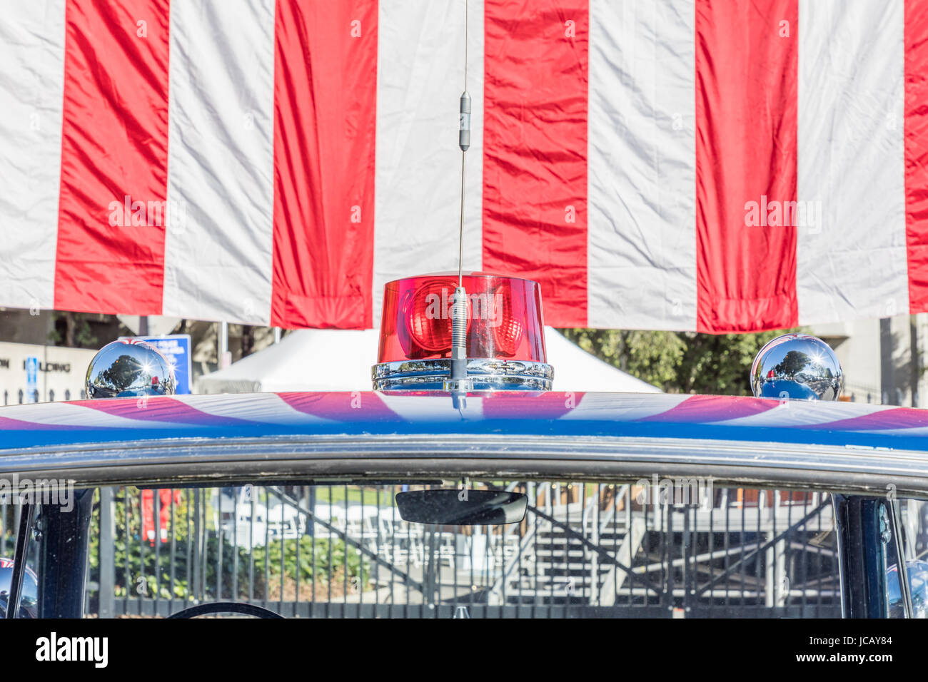 Antique Police Car with American Flag Stock Photo