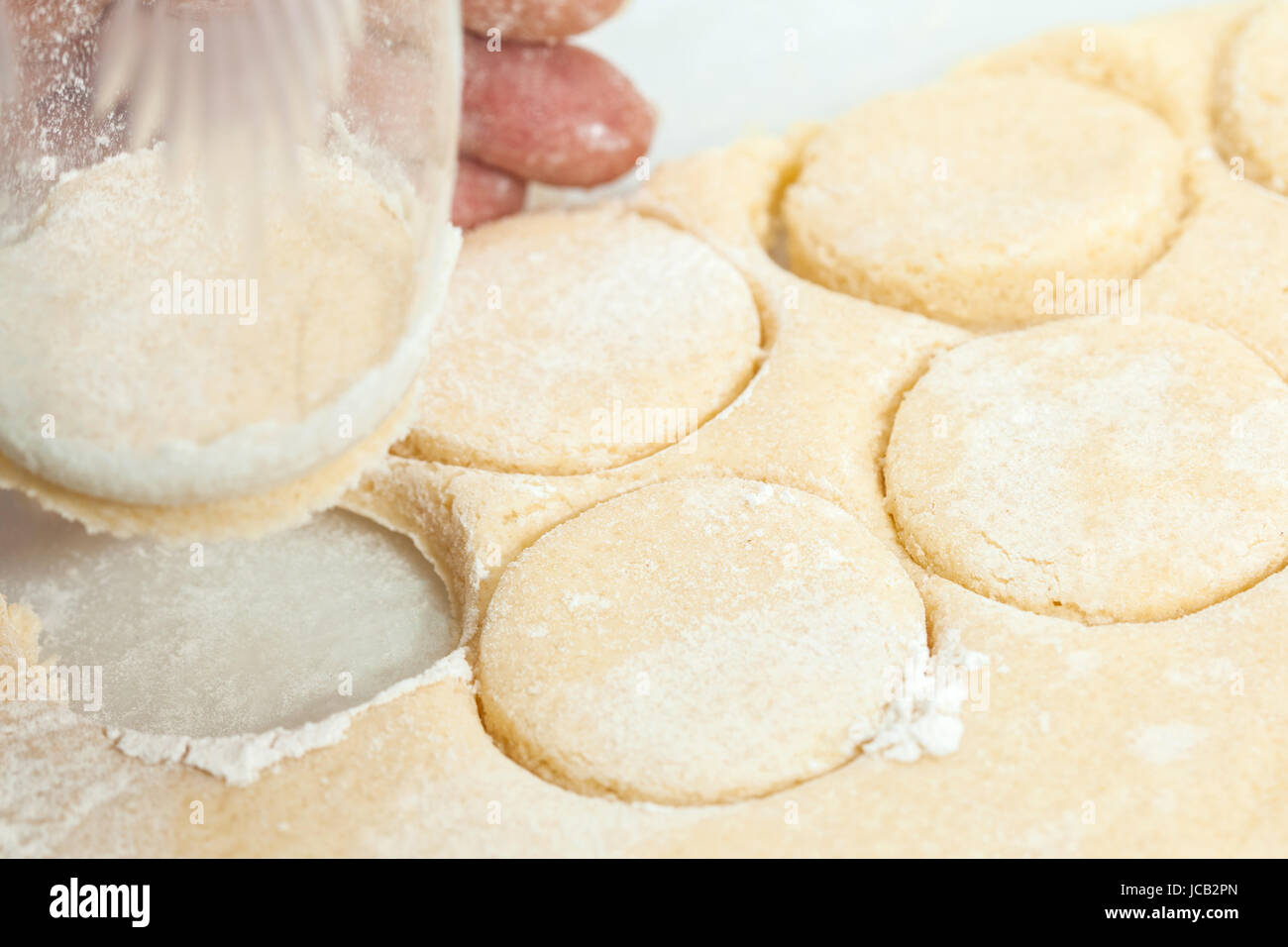 Butter Cookies Preparation : Round cut of cookie's dough Stock Photo