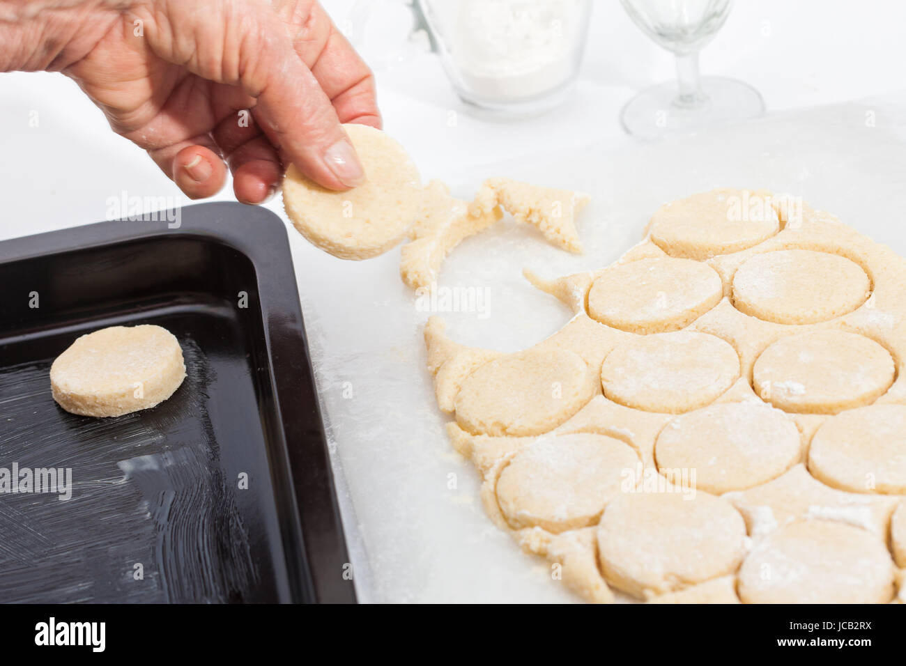 Butter Cookies Preparation : Round cut of cookie's dough Stock Photo