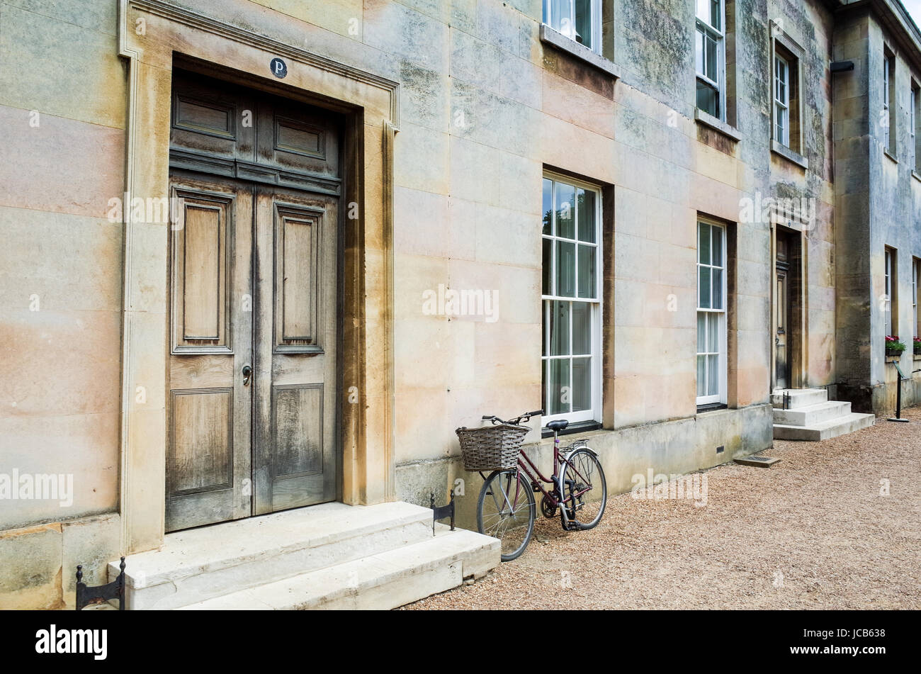 A student bike parked outside student accommodation in Downing College, part of the University of Cambridge, UK Stock Photo