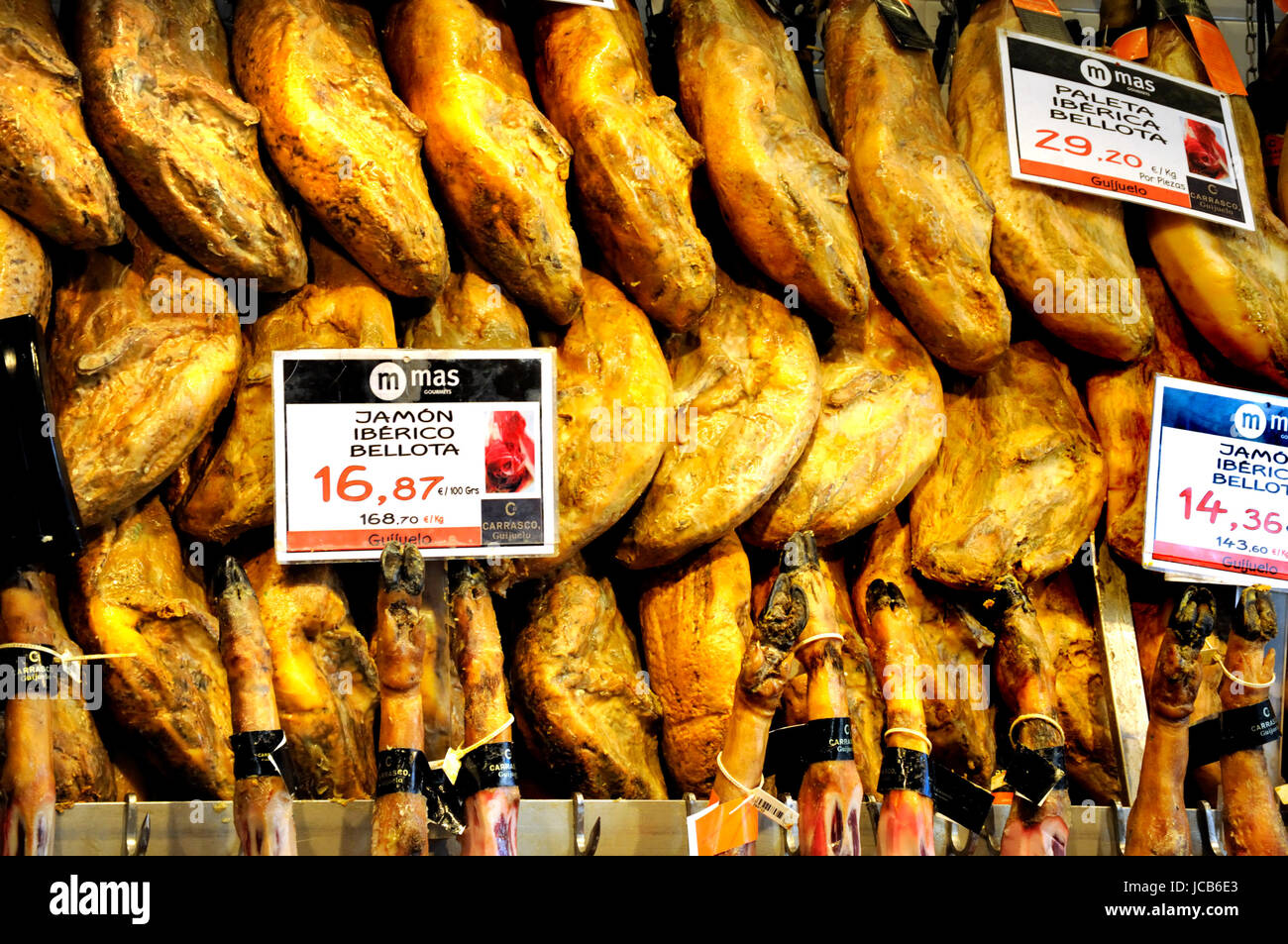 Madrid, Spain. Mercado de San Miguel  (covered ironwork market - 1916) Whole hams on sale - Jamon Iberico Bellota Stock Photo