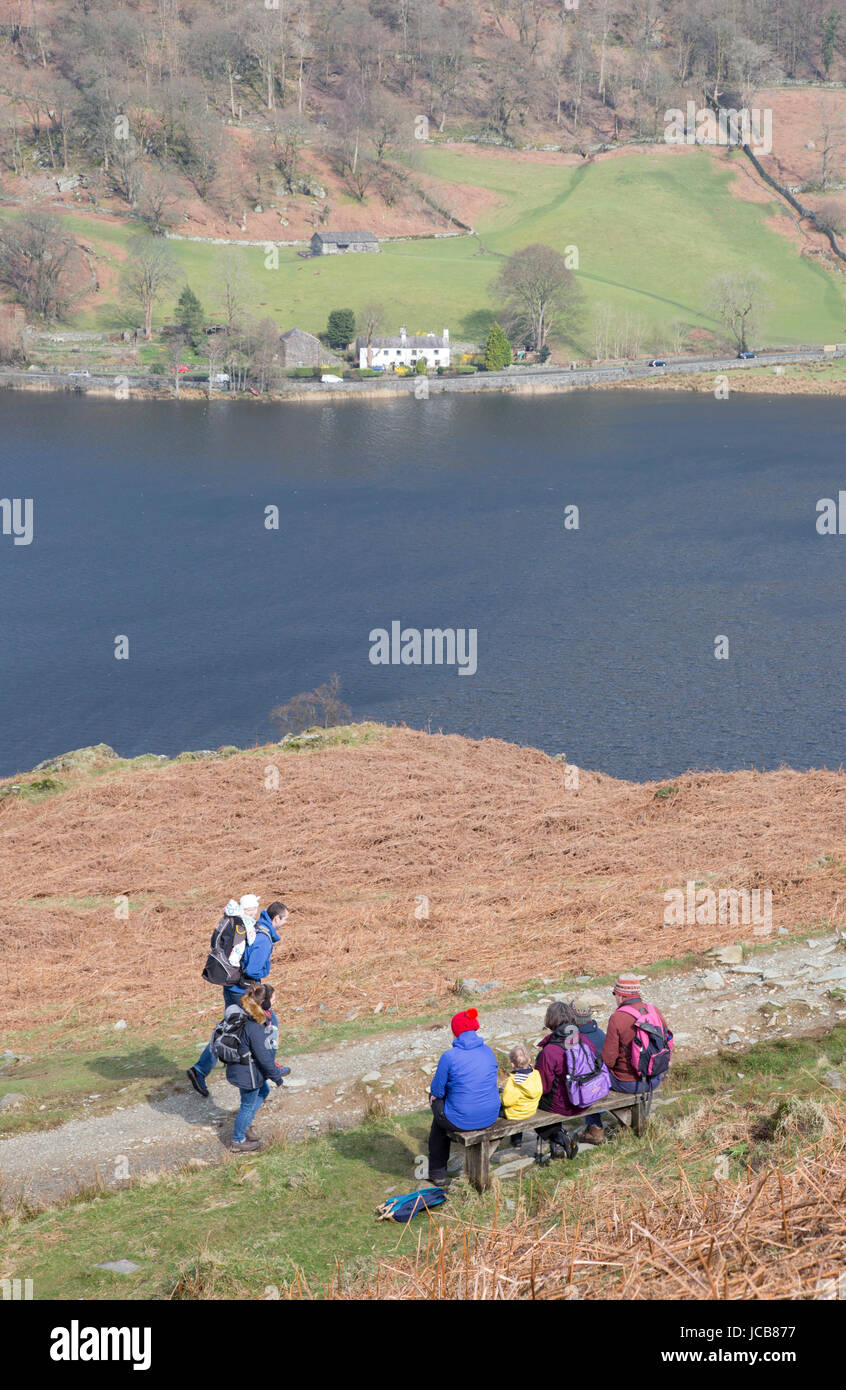 A family looking across Rydal Water near Ambleside, Cumbria, England, UK Stock Photo