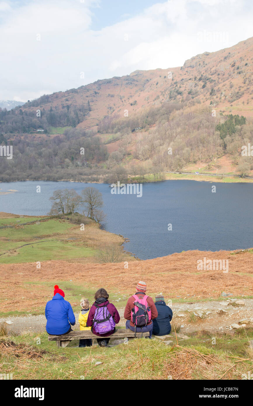 A family looking across Rydal Water near Ambleside, Cumbria, England, UK Stock Photo