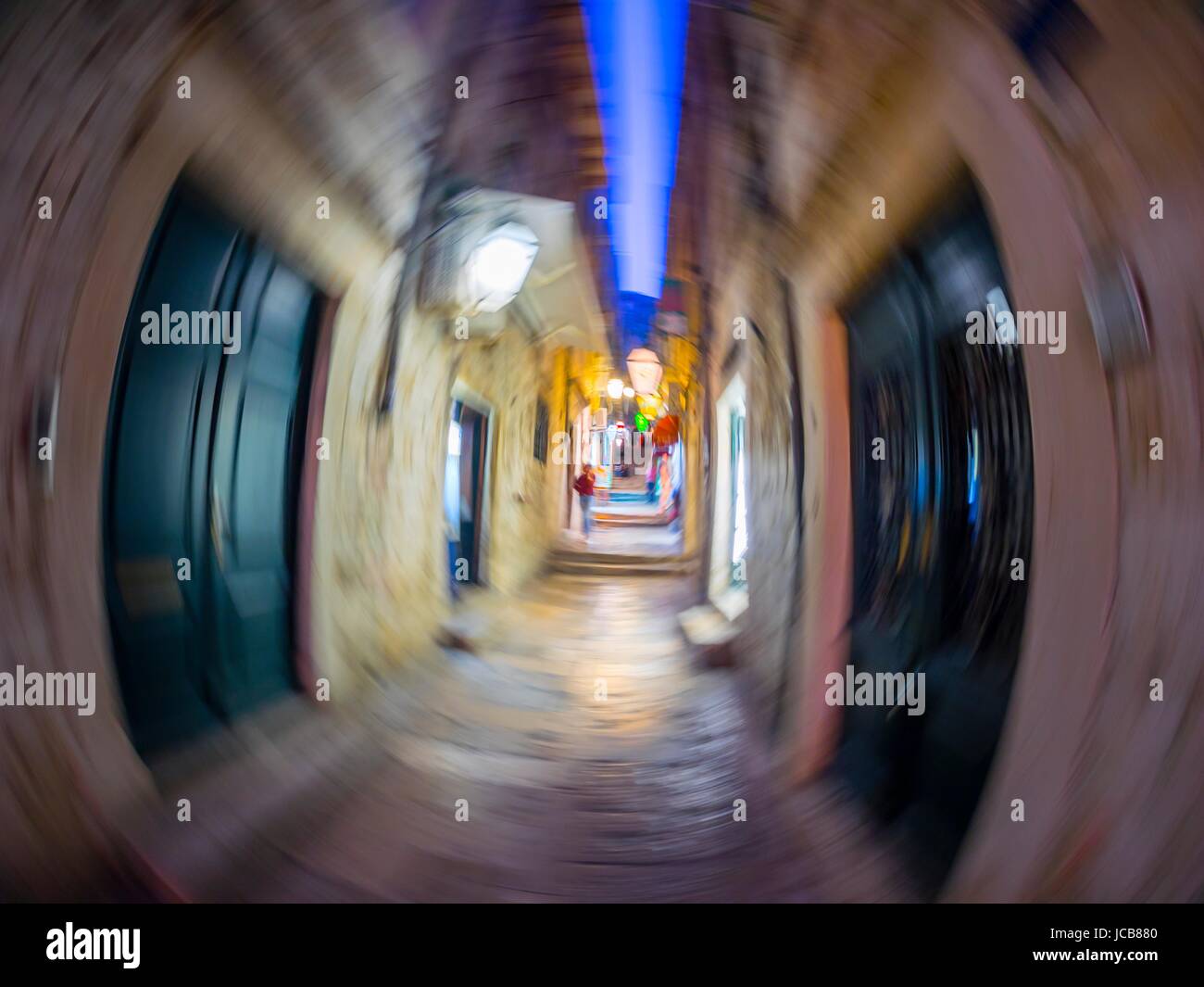 Dubrovnik old town in evening night tight street frenzy circular motion image Stock Photo