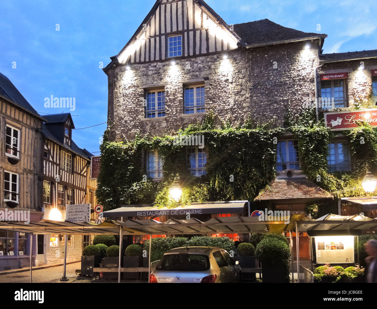 HONFLEUR, FRANCE - AUGUST 4, 2014: historical edifice Les maisons de Lea in Honfleur town, France. It is made up of an old salt warehouse and three 16thC houses, and sits in the Place Sainte Catherine Stock Photo