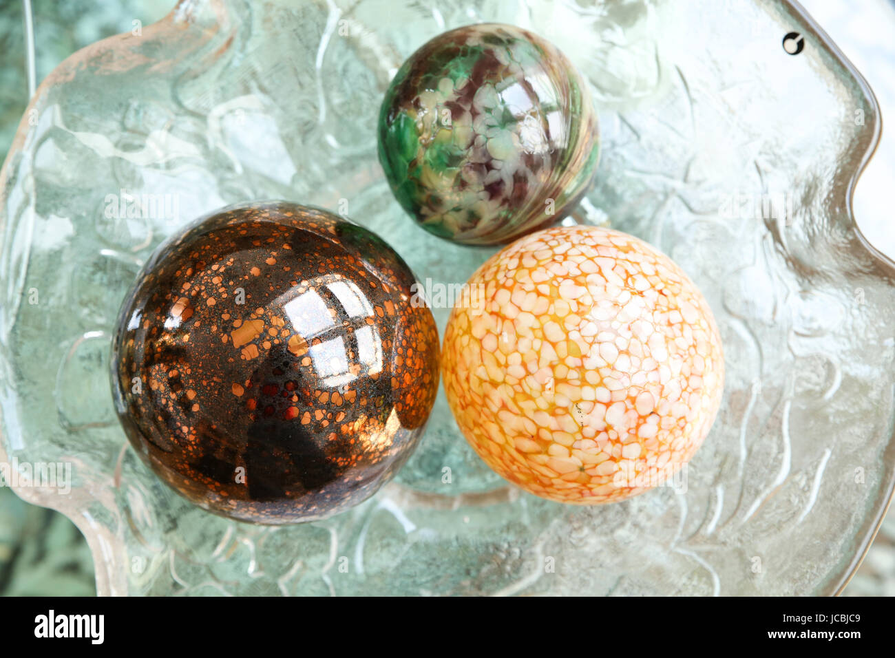 Some Decorative Christmas Spheres In A Glass Bowl Stock Photo
