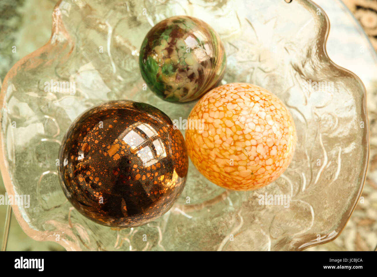 Some Decorative Christmas Spheres In A Glass Bowl Stock Photo