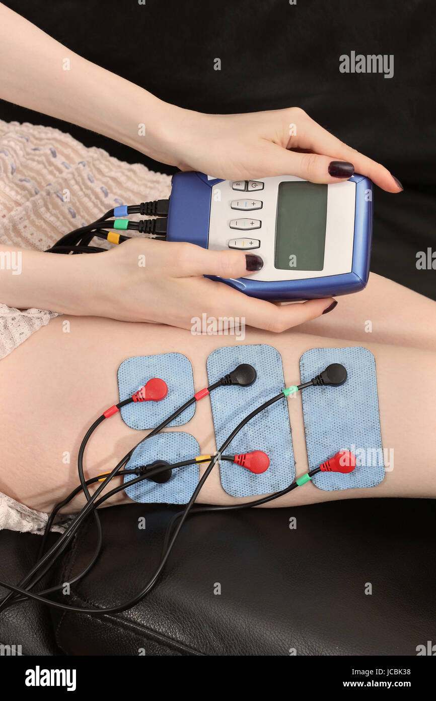 Electro muscle stimulation appliance with attached electrodes Stock