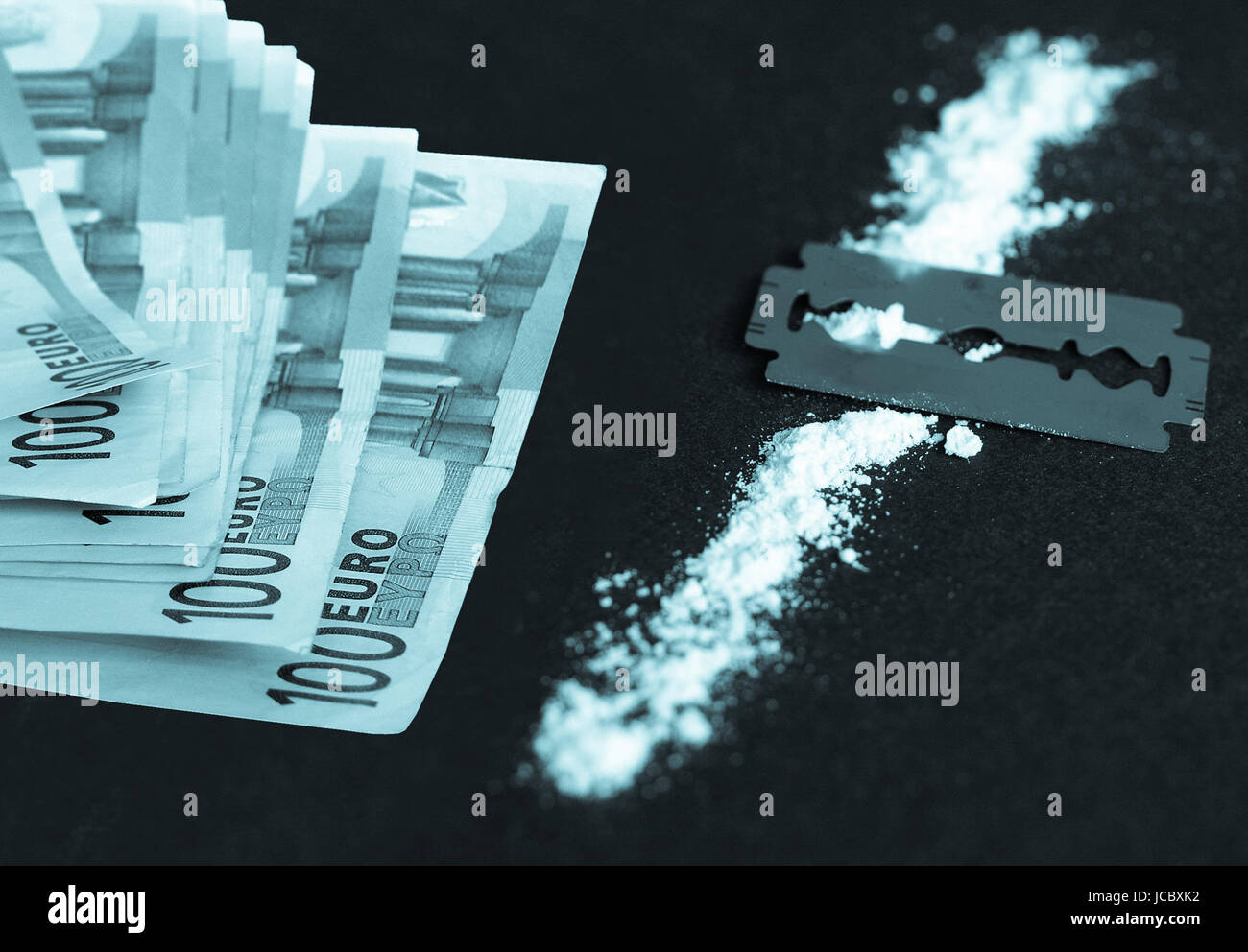 Cocaine, razor blade and money (simulation using wheat flour, no actual