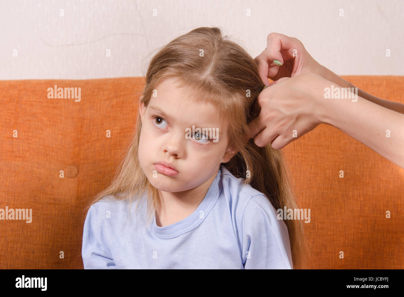 Upset Five Year Old Girl Trying To Get Your Hair Braided Mom Stock