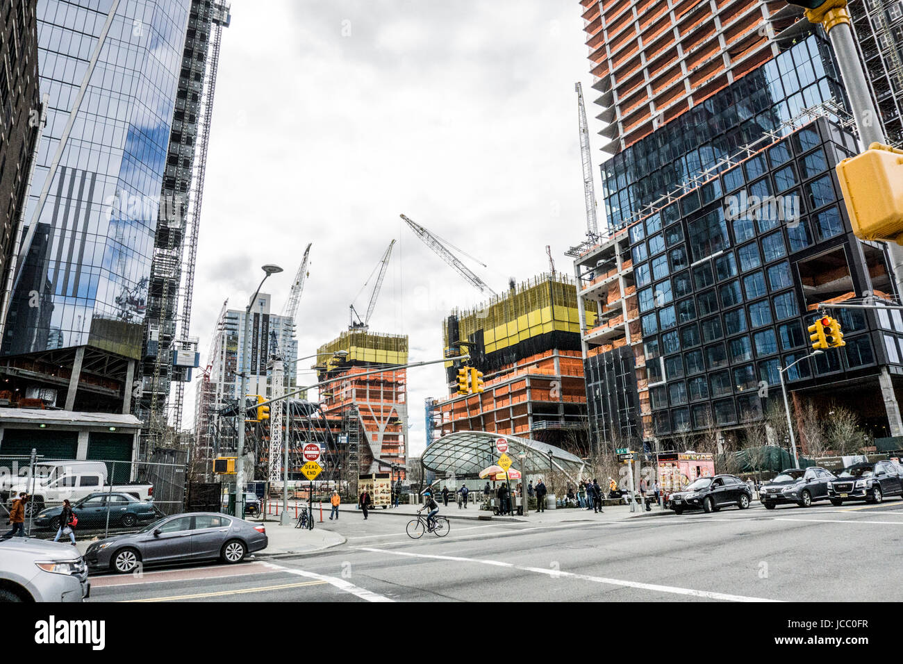 delicate glazed clamshell canopy designed by Toshiko Mori for escalators leading to new subway station is dwarfed by mammoth Hudson Yards construction Stock Photo