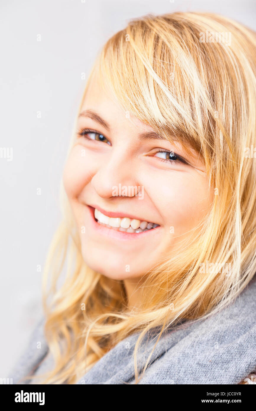 An image of a beautiful smiling blond girl Stock Photo - Alamy