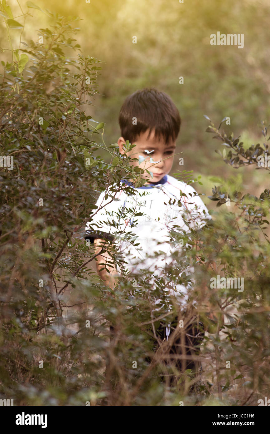 Boy with green eyes in the park Stock Photo Alamy