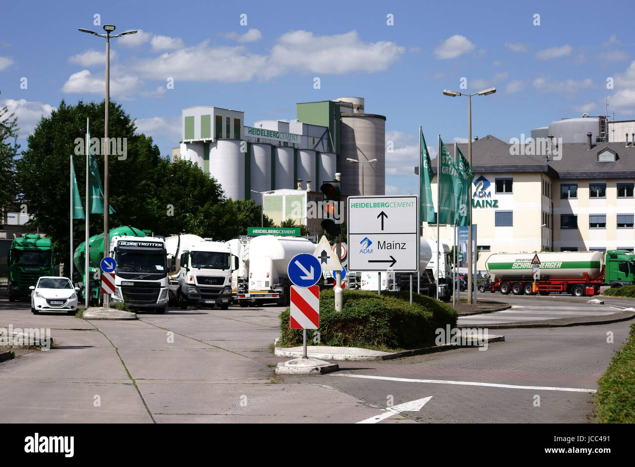 Mainz, Germany - June 10, 2017: Parking trucks are parked in front of the entrance to Heidelberg cement plant on June 10, 2017 in Mainz. Stock Photo