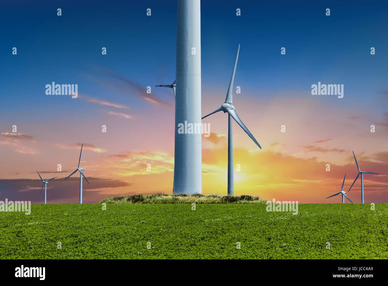 Alternative energy source, Wind turbines sunset, Power production Germany countryside Germany wind turbine farm sunset Stock Photo