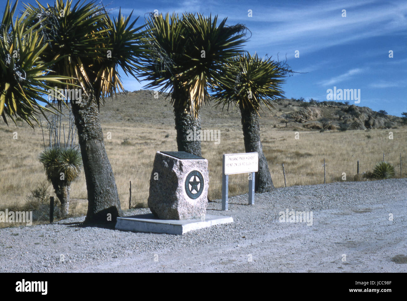 Antique January 1959 photograph, marble marker and sign for Paisano Pass, the highest point on US 90 in Marfa, Texas. SOURCE: ORIGINAL 35mm TRANSPARENCY. Stock Photo