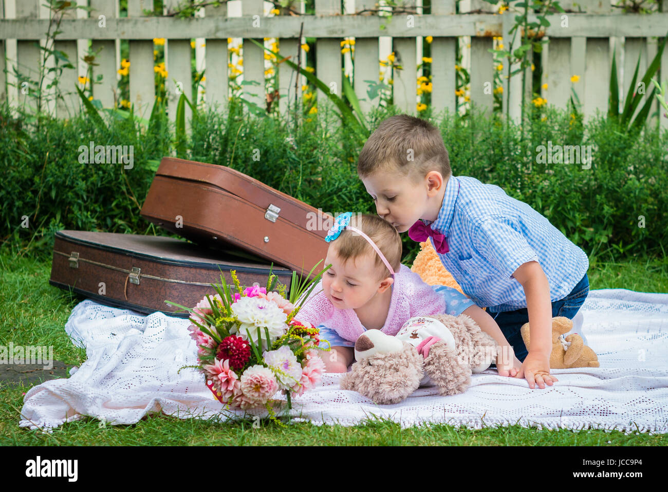 Girl and a boy in garden Stock Photo Alamy
