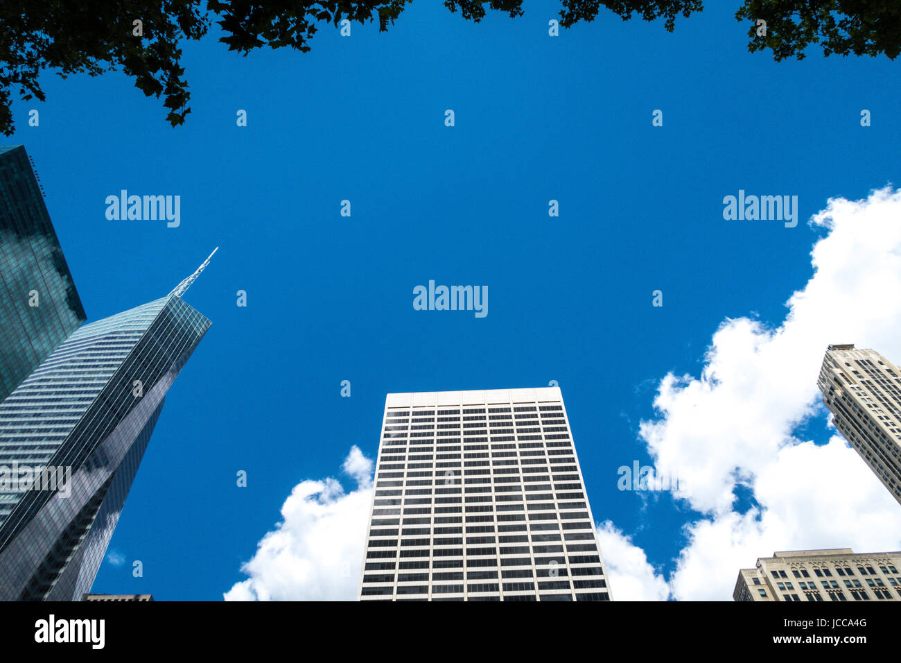 Looking up at the Skyscrapers Surrounding Bryant Park, NYC, USA Stock Photo