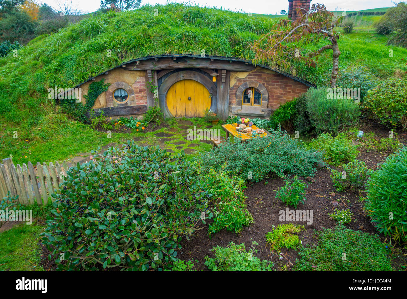 NORTH ISLAND, NEW ZEALAND- MAY 16, 2017: Hobbit house with yellow door, hobbiton movie set, site made for movies: Hobbit and Lord of the ring in Matam Stock Photo