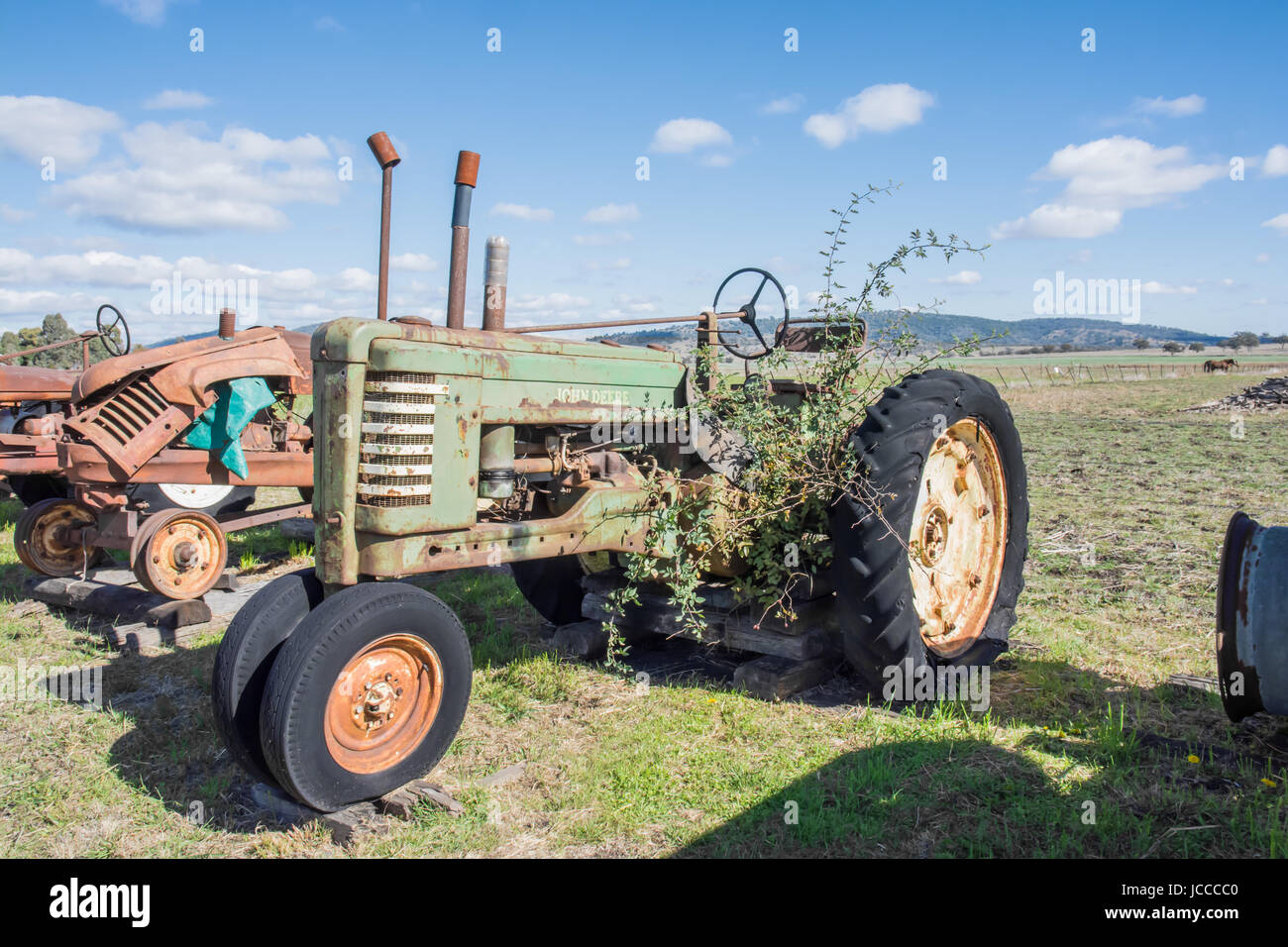 An Old John Deere Farm Tractor waiting for Restoration in a rural paddock Stock Photo Alamy